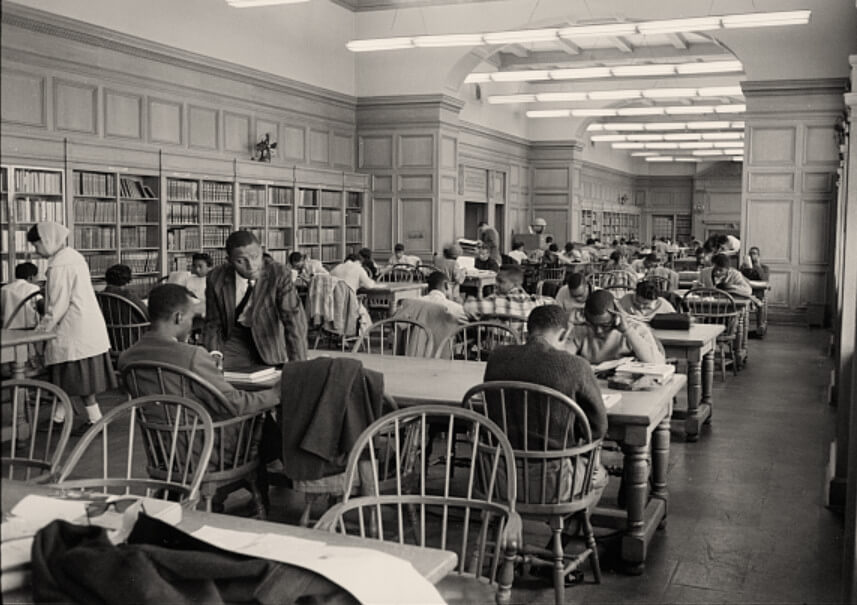 Students studying at tables in a library at Howard University, Washington, D.C, 1958, Library of Congress